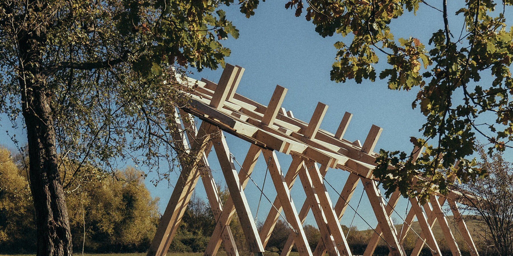 grriz-geometric-timber-stage-arc-of-setting-sun-italian-mountains02