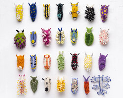 see the ocean’s psychedelic sea slugs reimagined as tiny wool sculptures