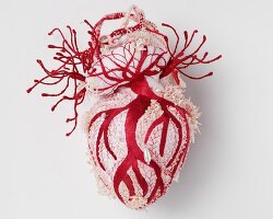 ema shin explores memory and care with monumental embroidered heart