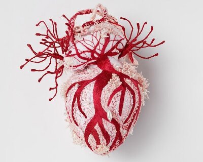 ema shin explores memory and care with monumental embroidered heart