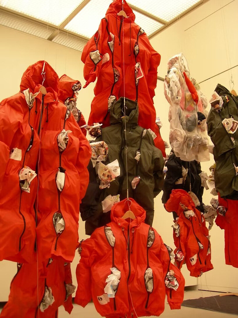 kosuke tsumura's 44-pocket parka explores survival through wearable space - 3