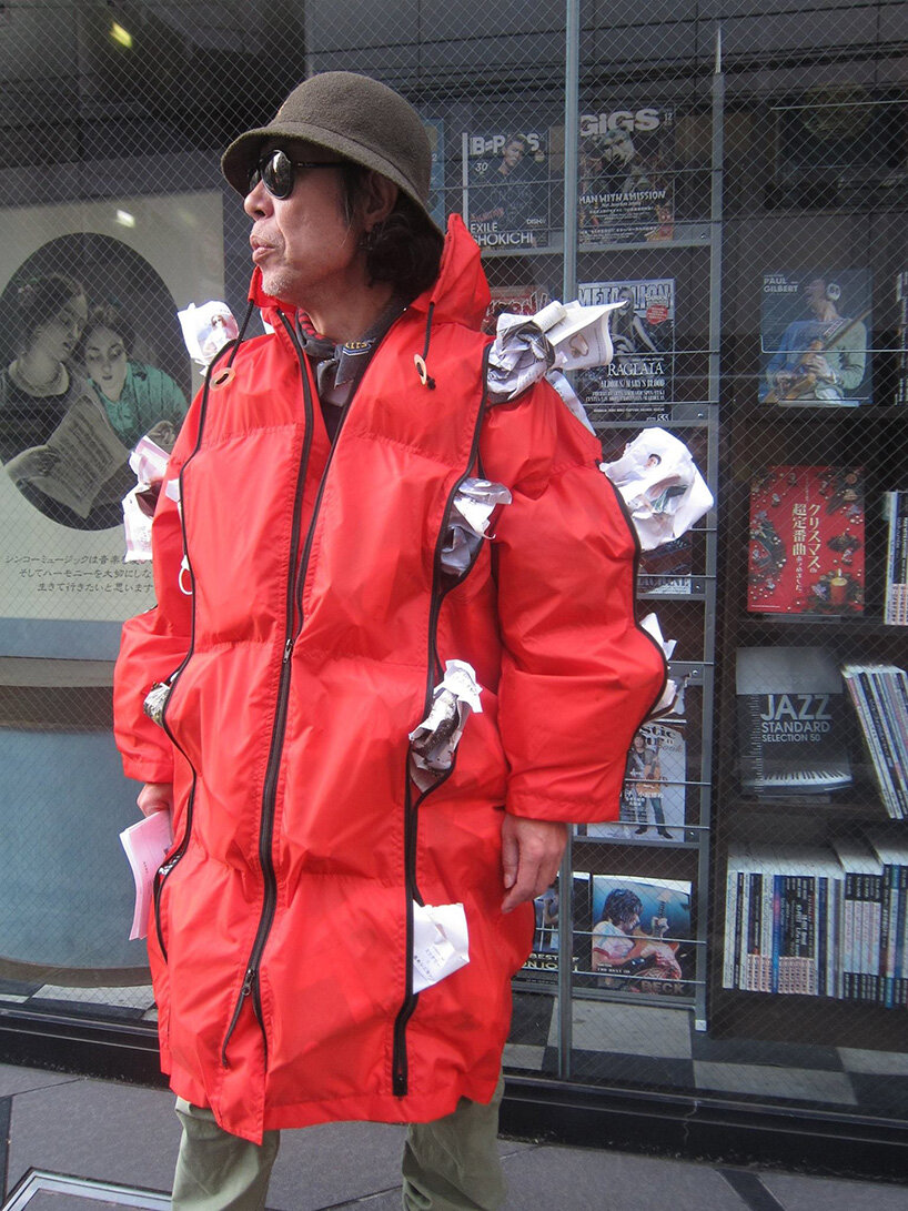 kosuke tsumura's 44-pocket parka explores survival through wearable space - 5