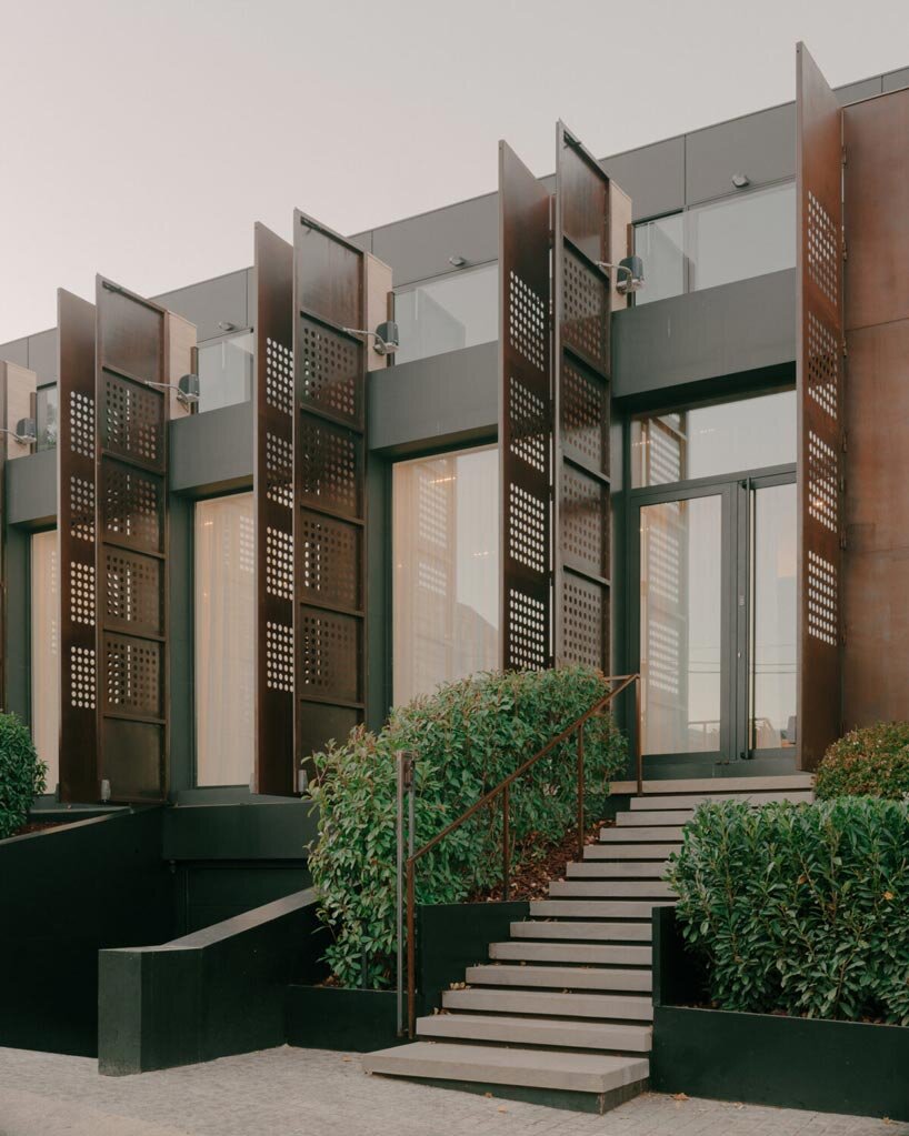 punctured iron doors shape kinetic facade by TIMM architecture in tbilisi - 6