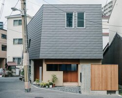 concrete and timber converse in osaka residence through an interplay of solid and void