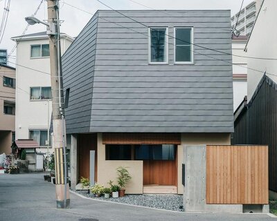 concrete and timber converse in osaka residence through an interplay of solid and void