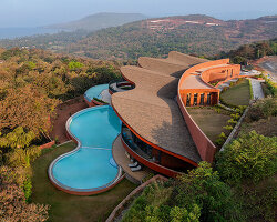 sanjay puri architects shapes 'crest nine' with a parabolic rooftop above the arabian sea