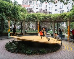 studio RE+N turns abandoned planter into floating yellow stage in shanghai neighborhood