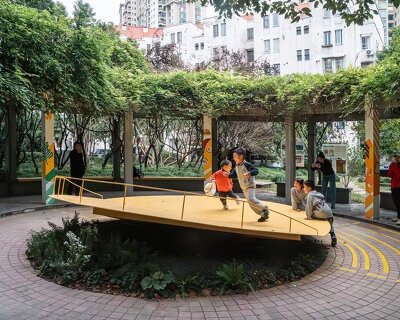 studio RE+N turns abandoned planter into floating yellow stage in shanghai neighborhood