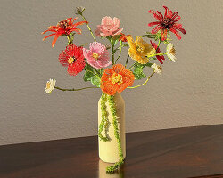 thousands of glass beads form delicate blossoms that never wilt in henri purnell's sculptures