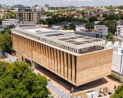 rammed earth finned facade wraps adjaye associates’ studio in accra, ghana