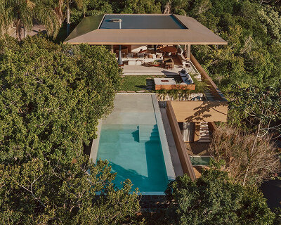 arthur casas adapts speculative structure into wood-lined coastal house in brazil