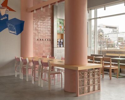raw concrete meets marshmallow-inspired palette within drinkit flagship café