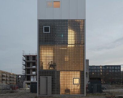glass block facade wraps studioninedots’ playfully stacked box residence in amsterdam