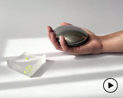 aluminum and acrylic handheld objects frame touch, weight, and movement as design tools
