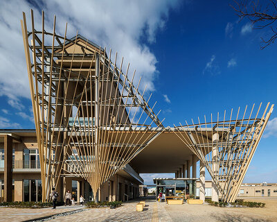 kengo kuma sculpts radiating hinoki louvres throughout new library in chikujō, japan