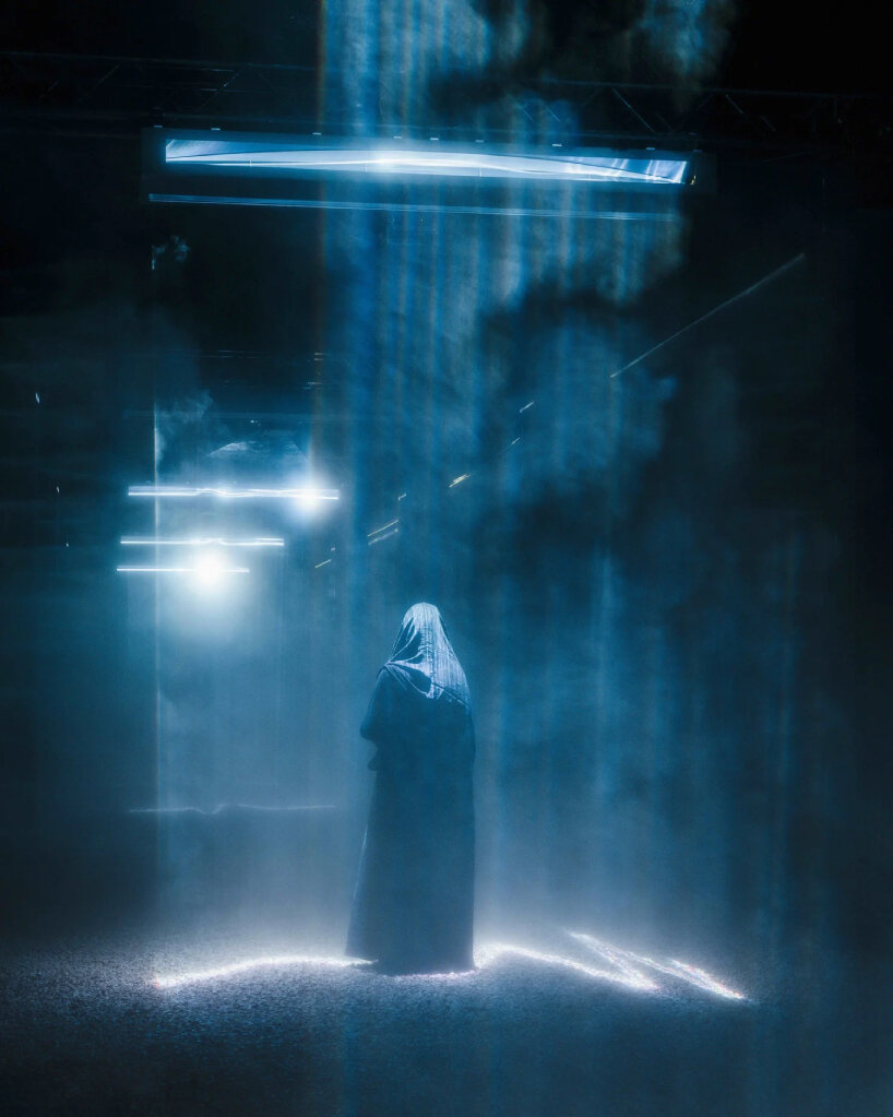 each structure carries laser projectors and custom optics that transform divergent beams into parallel planes