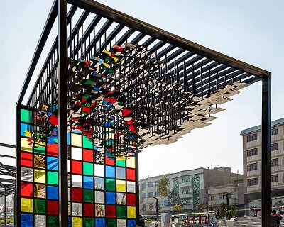 hundreds of suspended mirrors turn iranian pavilion into a shifting light machine