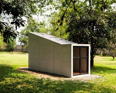 thin concrete walls frame tiny chapel by S-AR, built from its own remains
