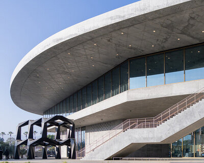 peter zumthor's david geffen galleries open at LACMA as a sweeping glass-and-concrete arc