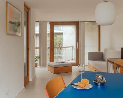 former sewage tank transforms into minimal geometric apartment in amsterdam