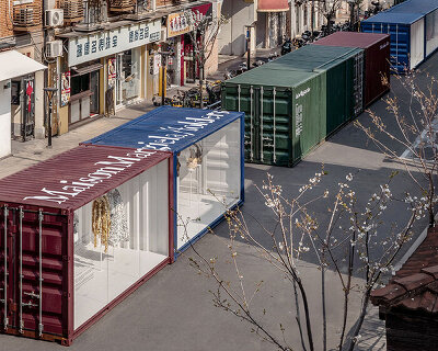 shipping containers frame maison margiela's shanghai exhibition by OMA / AMO in china