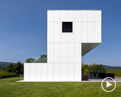 white aluminum cladding wraps tetris-like residence along lake in poland