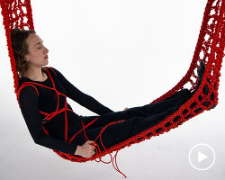 a suspended self-binding hugging hammock simulates the sensation of human embrace