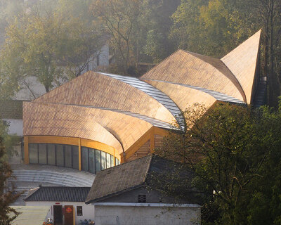 sweeping timber roof crowns a workshop reviving rural craft traditions in china