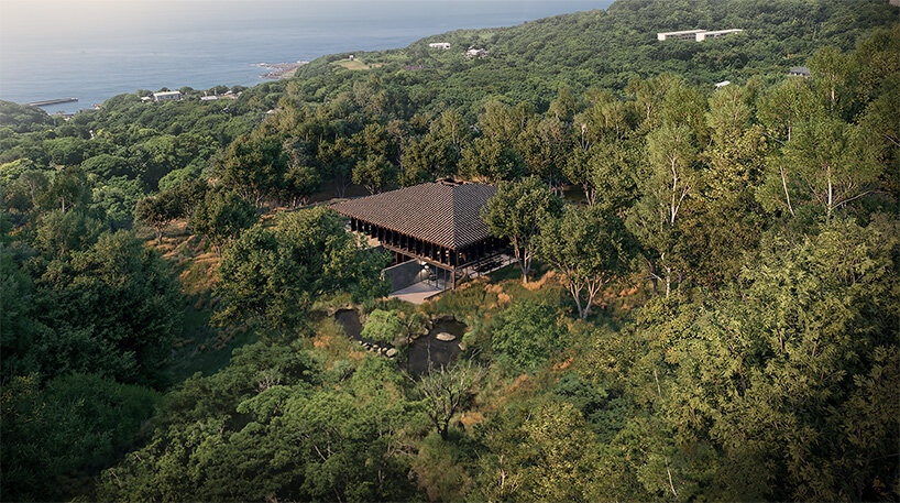 V taller proposes forest retreat around monolithic stone core for NOT A HOTEL in japan - 2