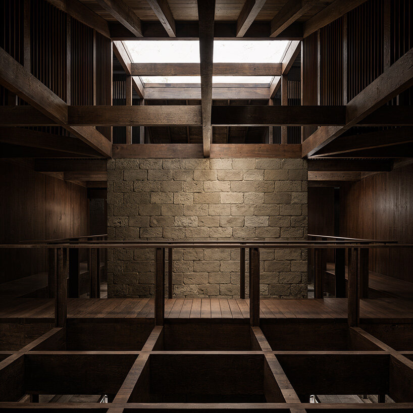 V taller proposes forest retreat around monolithic stone core for NOT A HOTEL in japan - 11