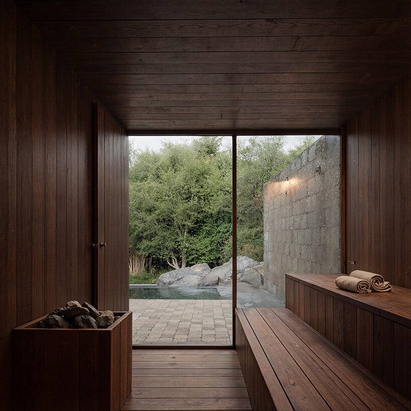 V taller proposes forest retreat around monolithic stone core for NOT A HOTEL in japan - 10
