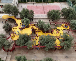 ZAV architects weaves a modular yellow playground through an olive orchard in iran