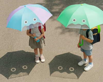 this children's umbrella casts playful characters onto the ground, making sun protection fun