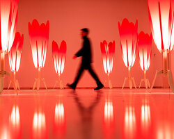 translucent red acrylic tulips form a glowing participatory light and sound installation