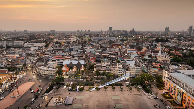recyclable fabric ribbons weave between bangkok’s streetlights into colorful urban canopy - 7