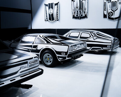five hand-painted cars fill joshua vides' monochromatic garage at the petersen