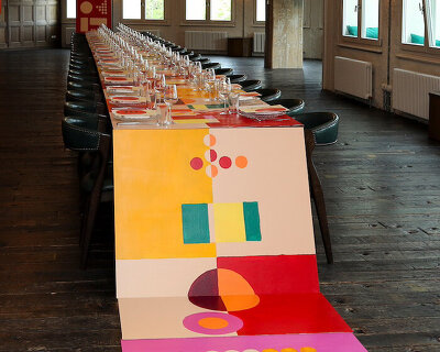 35-meter hand-painted table transforms dining into an immersive installation in berlin