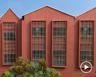 underused house reconfigures into child-centered bright red preschool in india