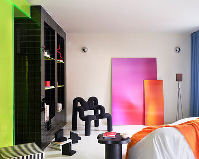 neon colors, transparent acrylic, and stone shape a layered apartment interior in madrid