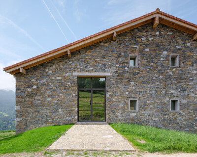 reclaimed stone and timber reshape a basque farmhouse adapted for contemporary living
