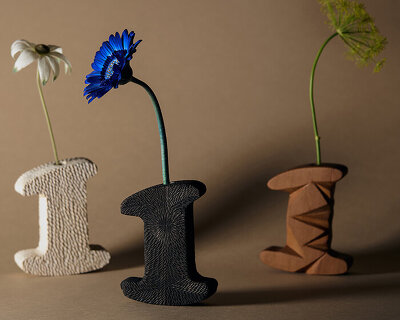 single-stem vases reinterpret number 1 through porcelain, bronze, and wood