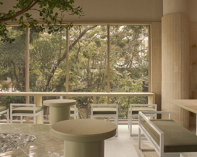 handmade terracotta tiles meet oak surfaces within tri-oz café’s tranquil interiors in thailand