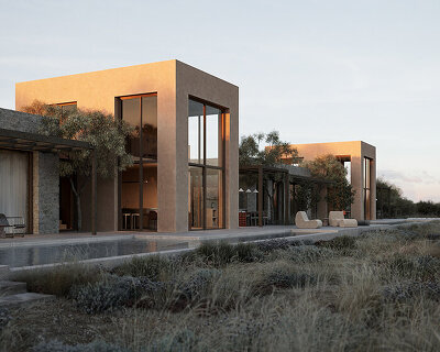 linear pergolas in warm tones outline a series of interconnected houses on a greek island