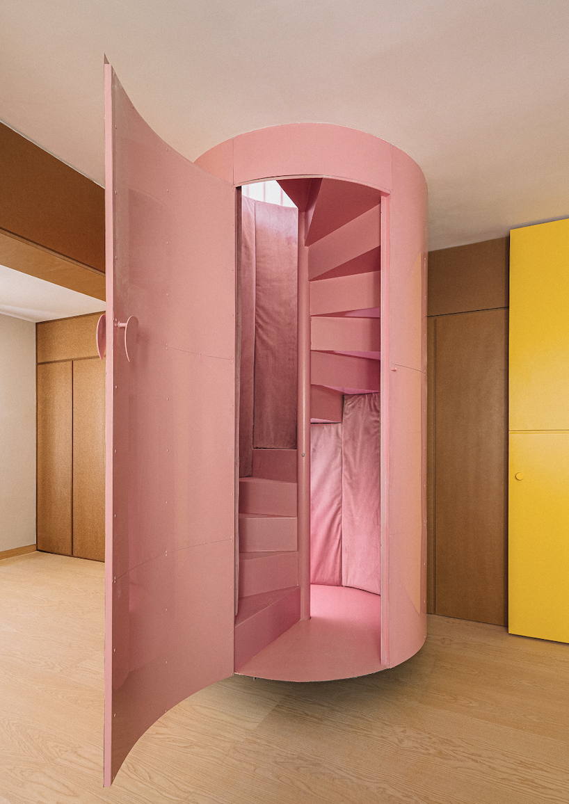 BURR renovates madrid apartment with yellow storage walls and pink spiral staircase - 2