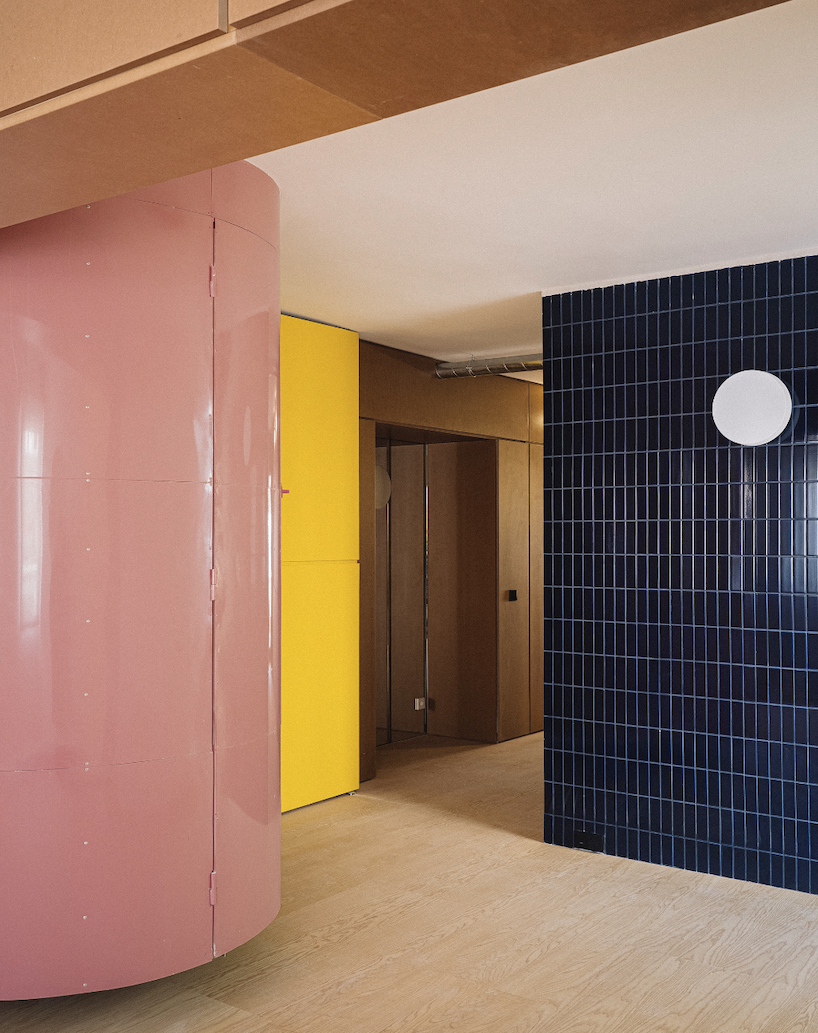 BURR renovates madrid apartment with yellow storage walls and pink spiral staircase - 1