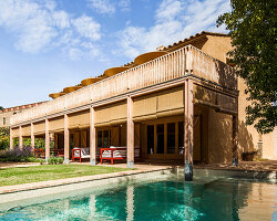 anna & eugeni bach reframes house in fonolleres with wood and ochre ceramics