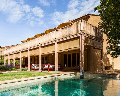 anna & eugeni bach reframes house in fonolleres with wood and ochre ceramics