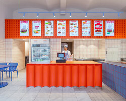 blue, red, and orange interiors bring seoul’s visual energy to the kimchi restaurant in prague