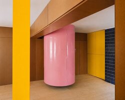 BURR renovates madrid apartment with yellow storage walls and pink spiral staircase