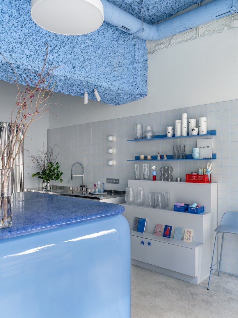 colorful furnishings and raw textures animate an open-plan flower shop - 1